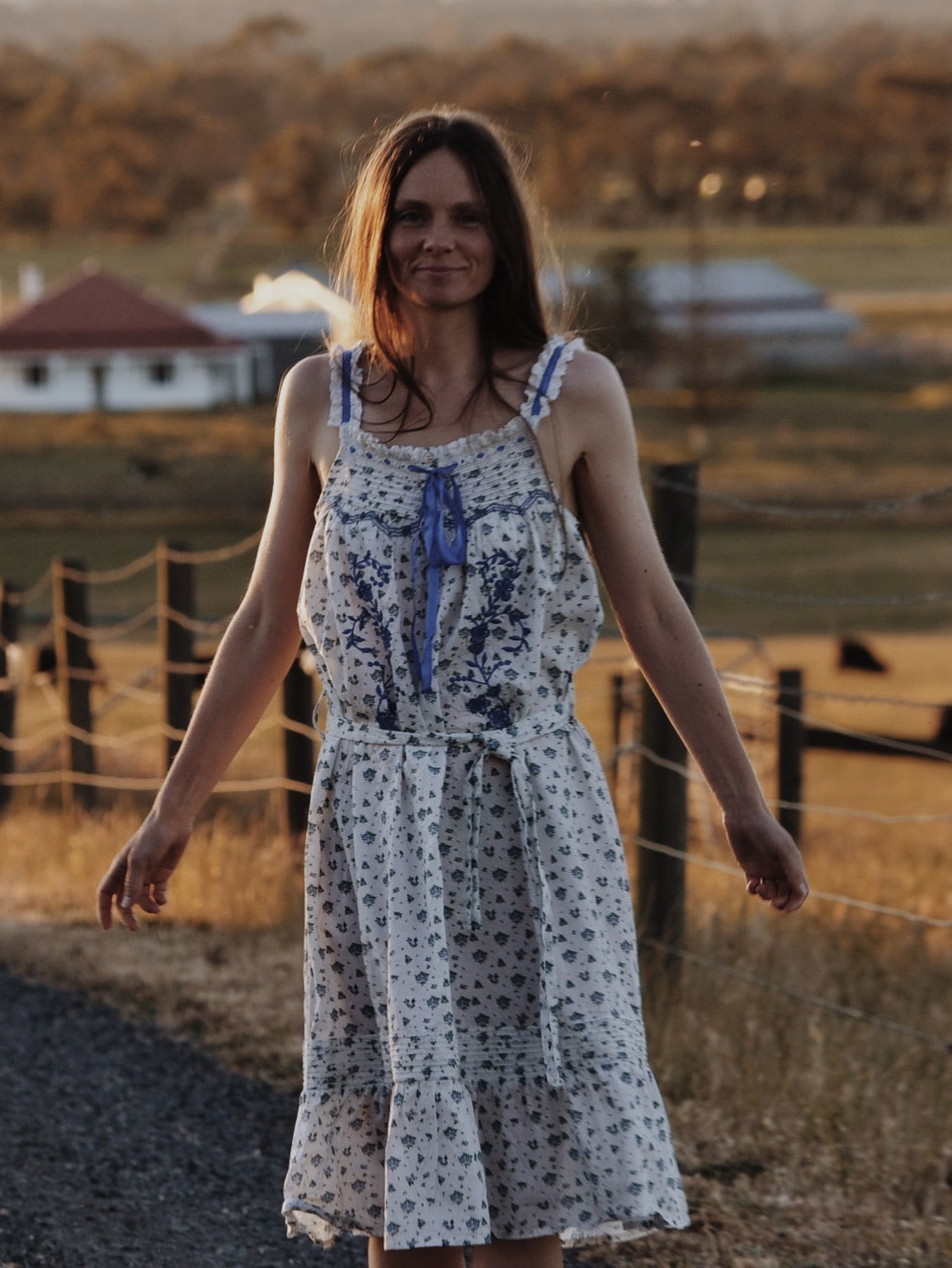 100% RECYCLED COTTON - NIGHTINGALE HAND SMOCKED MIDI DRESS BLUE ROSE FLORAL